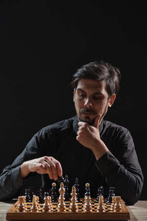 Portrait of adult man who is participating in chess game.の写真素材