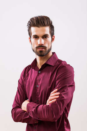 Studio shot portrait of young angry businessman.の写真素材