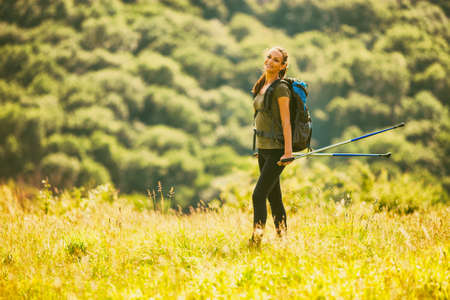 Young woman is hiking in mountain and enjoying nature.の写真素材