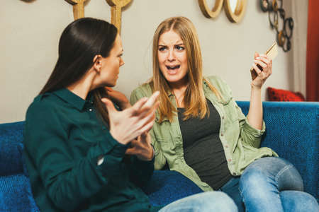 Two women are arguing in cafe.の写真素材