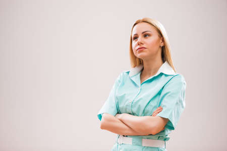 Portrait of young nurse who is worried and pensive.の写真素材
