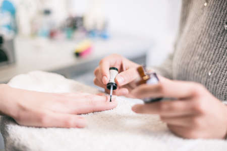 Manicure process at professional saloon. Nail treatment.の写真素材