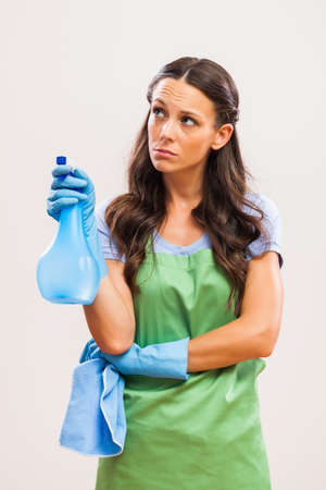 Portrait of housewife who doesn't like cleaning.の写真素材