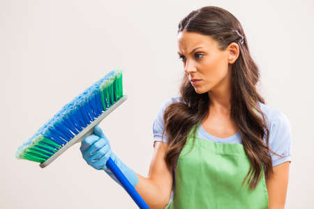 Portrait of housewife who doesn't like cleaning.の写真素材