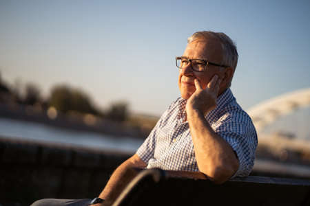 Outdoor portrait of worried and lonely senior man.の写真素材