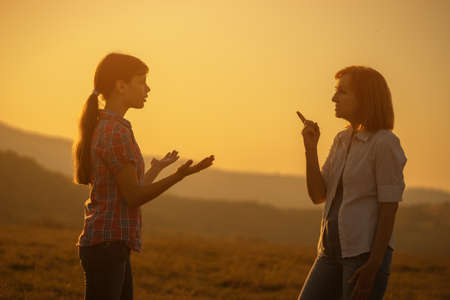 Grandmother and granddaughter are arguing.の写真素材