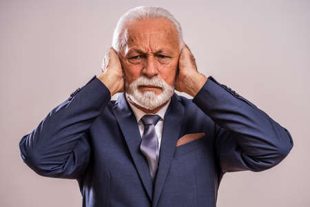 Portrait of senior businessman who is tired and frustrated.の写真素材