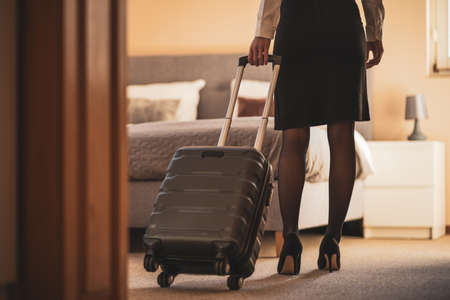 Businesswoman arrived in hotel room.の写真素材