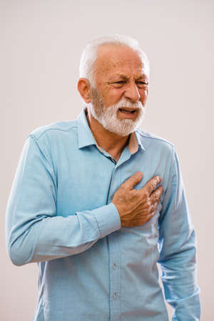 Portrait of senior man who is having pain in his chest.の写真素材