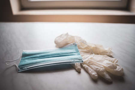 Close up image of medical mask and gloves. Virus pandemic protection concept.の写真素材