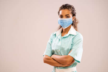 Portrait of young nurse with medical mask.の写真素材