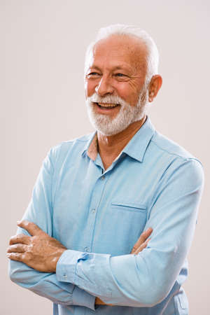 Portrait of cheerful senior man who is looking away.の写真素材
