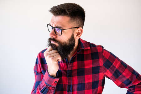 Portrait of man who is worried and thoughtful. Copy space on image for your text or advert.
