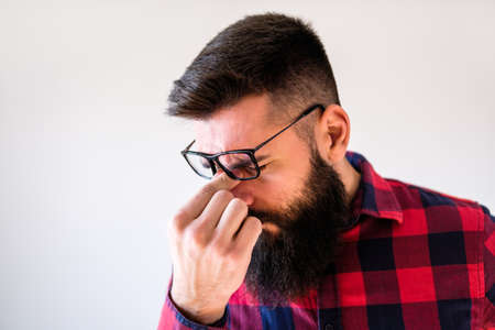 Portrait of man who is tired and having headache.の写真素材