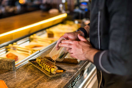 Sushi chef preparing Sushi at sushi restaurant.の写真素材
