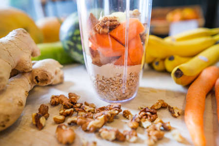 Healthy protein shake on table with fruits and vegetables ingredients around.の写真素材