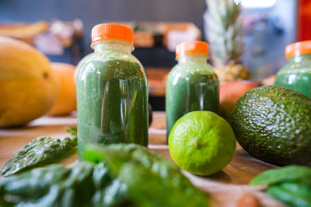 Healthy protein shake on table with fruits and vegetables ingredients around.の写真素材