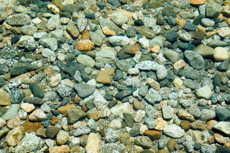 Background with large and small granite stones. Different colors