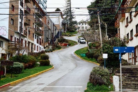 Road zigzagging up between buildings, San Carlos de Bariloche city, Rio Negroの写真素材