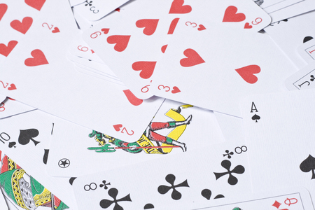 Set of playing cards are scattered on a table のeditorial素材