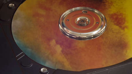 Surface of hard drive with burning reflectionの写真素材