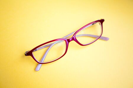 Fashion glasses on yellow backgroundの写真素材