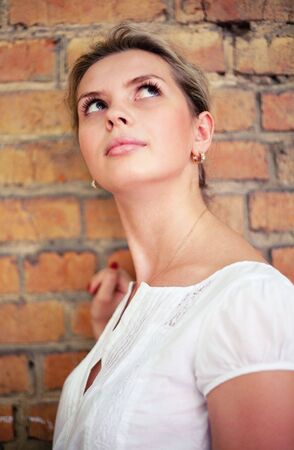 Young glamour women on brick backgroundの写真素材