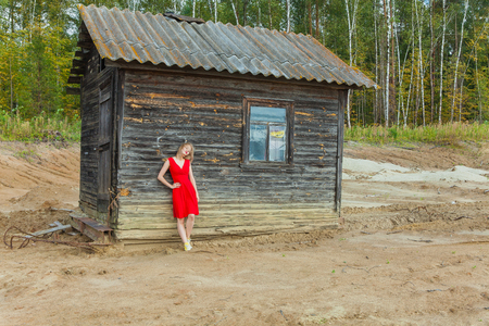 beautiful asian woman posing on old house backgroundの写真素材