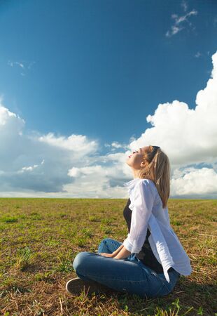 beautiful asian women looks at cloudsの写真素材
