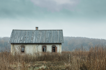 old abandoned house on autumn fieldの写真素材
