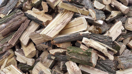 Throwing firewood on a pile. Stack with firewood.の写真素材