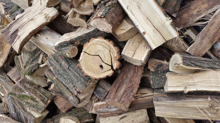 Throwing firewood on a pile. Stack with firewood.の写真素材