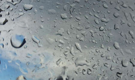 Rain water drops on blueの写真素材