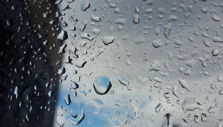 Rain water drops on blueの写真素材