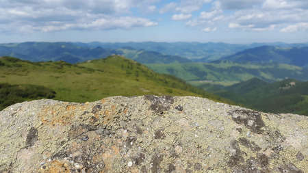 Stone texture for the lettering on the background of mountains and skyの写真素材