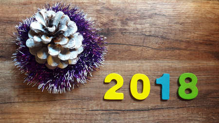 Wooden numbers forming the number 2018, For the new year 2018 on a wooden backgroundの写真素材