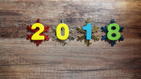 Wooden numbers forming the number 2018, For the new year 2018 on a wooden backgroundの写真素材