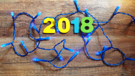 Wooden numbers forming the number 2018, For the new year 2018 on a wooden backgroundの写真素材