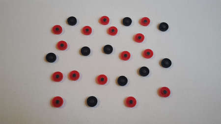 red and black round figures on a white canvas,,の写真素材