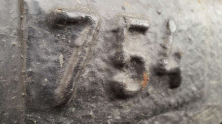 Metal number 754. Texture of rusty metal in the form of figures 754