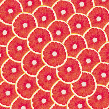 Red background with citrus fruit of grapefruit slicesの写真素材