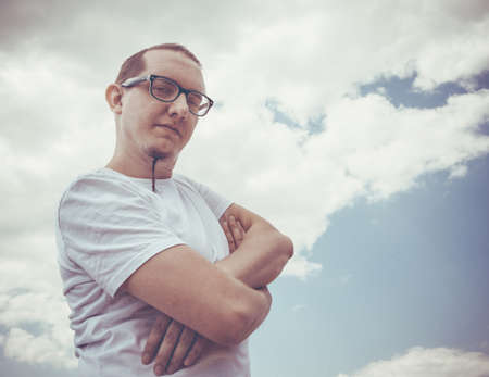 Stylish hipster man with a beard lifestyle  against the sky