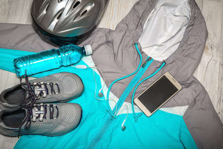 Sport stuff on wooden floor, top viewの写真素材