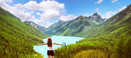 Freedom concept. Beauty girl in mountains on background view Kucherla lake on Altayの写真素材