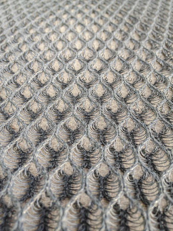 The details of the mesh honeycomb is a device seat motorcycle.