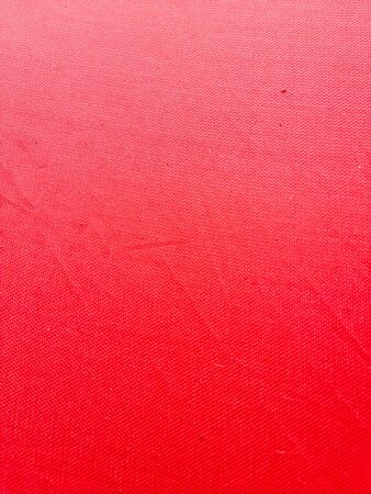 The background to the surface of the fabric, the red umbrellaの写真素材