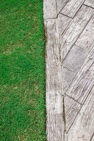 Grass and wood flooring, which is the background.の写真素材