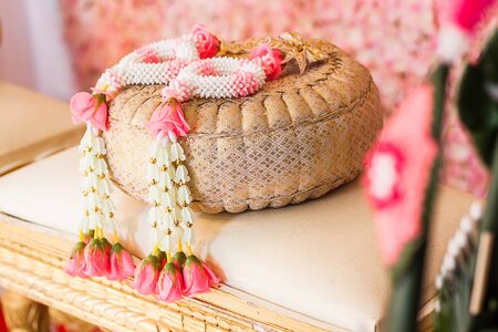 Garland was placed on a pair of pillow favorable to prepare a wedding ceremony.の写真素材