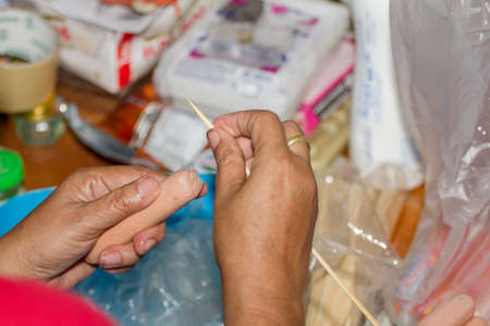 Prepare pork sausage to sell at the market.の写真素材