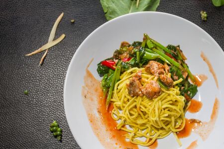 Stir-fried noodles with broccoli, canned fish is tasty. Thai style food.の写真素材